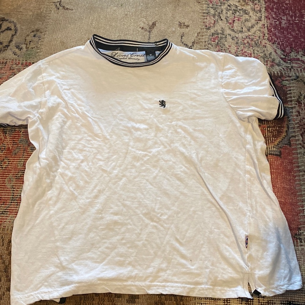 This shirt is good for going out, is a size medium that is outlined with black.